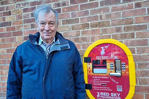 Councillor Paul Gibson with the new defibrillator in Doxford Park.