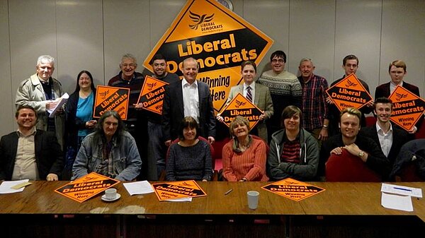 Sunderland Lib Dems in front of a big Lib Dem sign