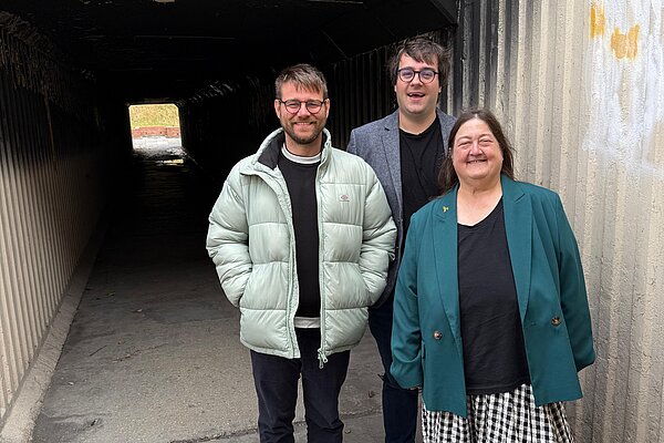Stephen O'Brien, Paul Edgeworth and Margaret Crosby standing in front of the Hastings Hill subway