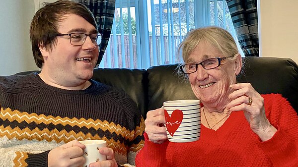 Paul Edgeworth chatting to a resident over a cup of tea