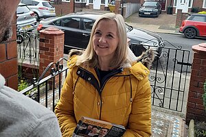 Julia Potts speaking at a doorstep in Thornhill